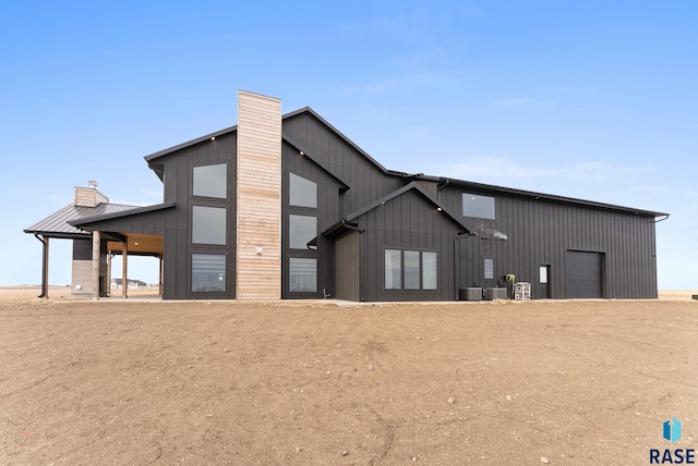 exterior space featuring a garage and central AC unit