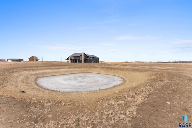 view of yard with a rural view