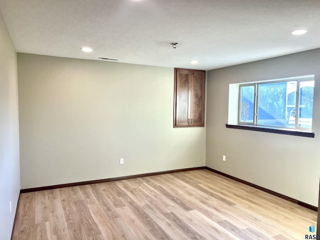 empty room featuring light hardwood / wood-style floors