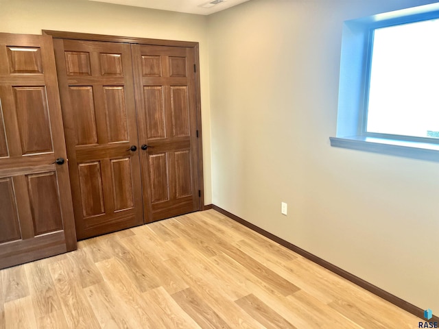 unfurnished bedroom featuring light hardwood / wood-style floors