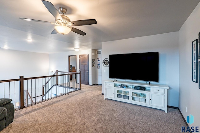 living room featuring light carpet and ceiling fan