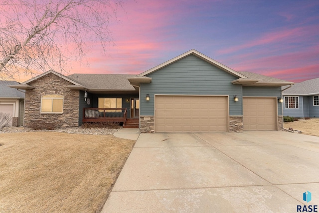 view of front facade featuring a garage and a porch