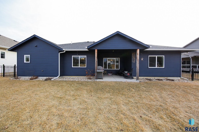 view of front facade with a patio area and a front yard