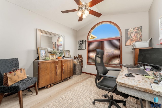 office area featuring vaulted ceiling, ceiling fan, and light hardwood / wood-style flooring