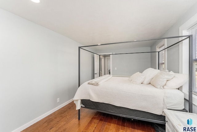 bedroom with hardwood / wood-style floors