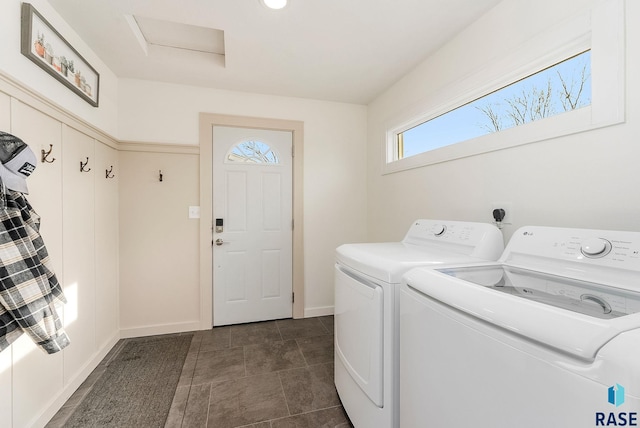 clothes washing area featuring separate washer and dryer