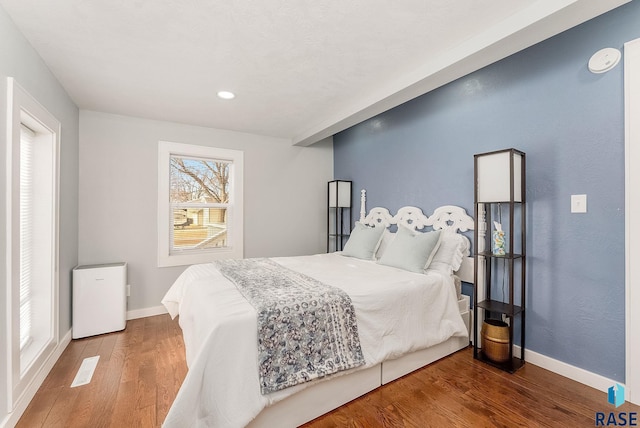 bedroom with wood-type flooring