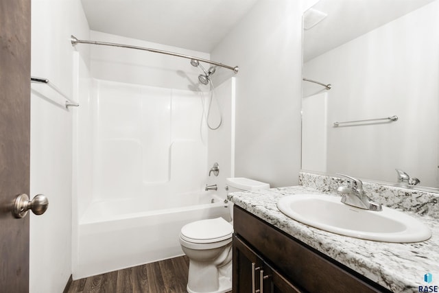 full bathroom featuring hardwood / wood-style flooring, vanity, toilet, and bathing tub / shower combination