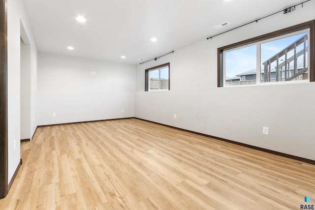 spare room with light wood-type flooring