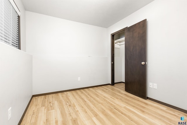 unfurnished bedroom with light wood-type flooring