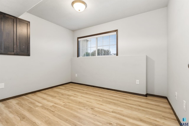 unfurnished room featuring light hardwood / wood-style flooring