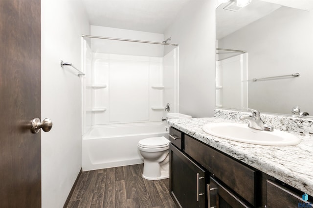 full bathroom with hardwood / wood-style flooring, shower / bathtub combination, vanity, and toilet