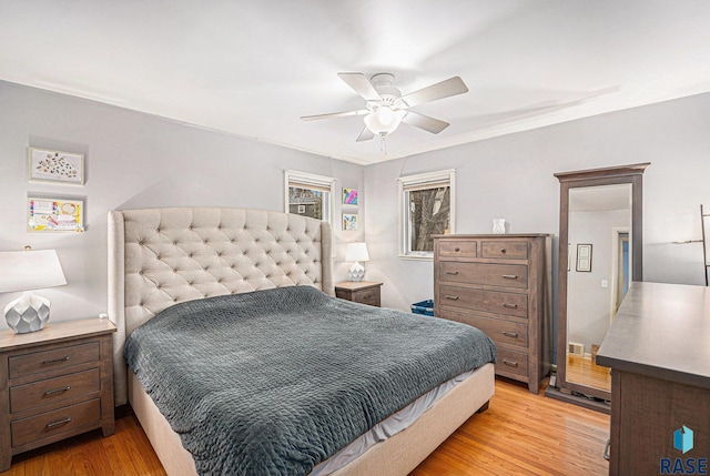 bedroom with ceiling fan and light wood-type flooring