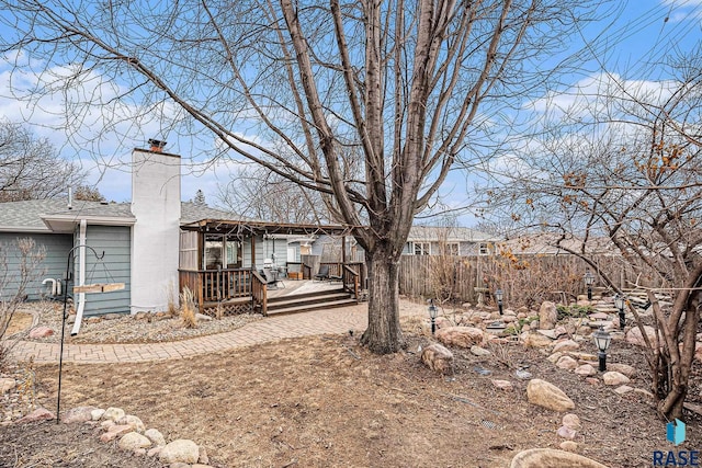 view of yard with a wooden deck