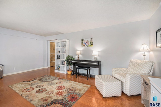 living area with hardwood / wood-style floors