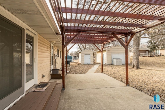 view of patio with a pergola and a shed