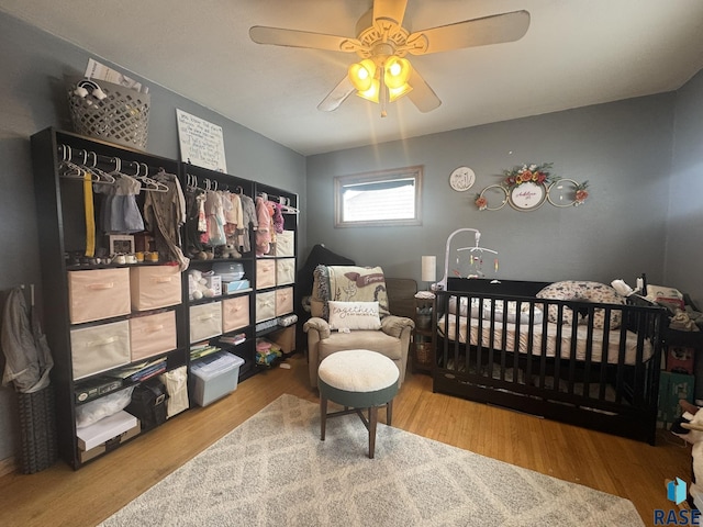 bedroom featuring ceiling fan and wood finished floors