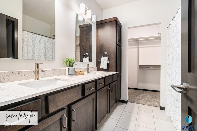 bathroom featuring tile patterned floors and vanity