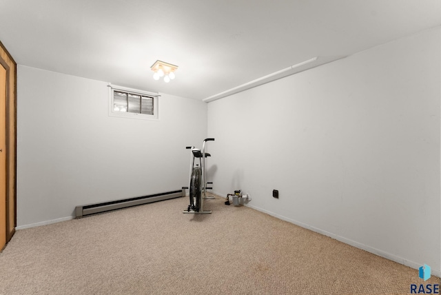 workout area with a baseboard heating unit and carpet flooring