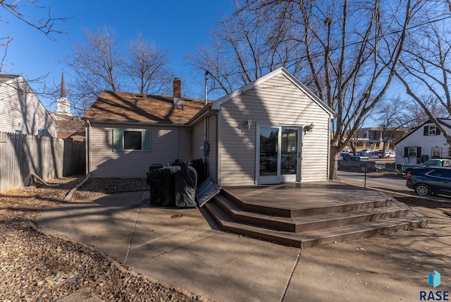 back of property with a patio and a wooden deck