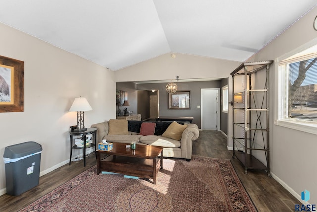 living room with lofted ceiling and dark hardwood / wood-style floors