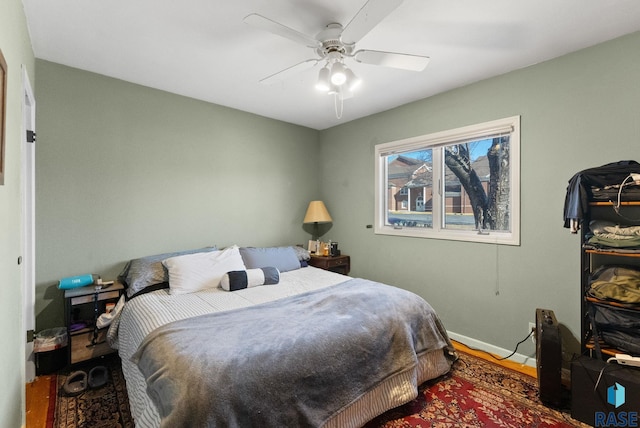 bedroom featuring wood-type flooring and ceiling fan