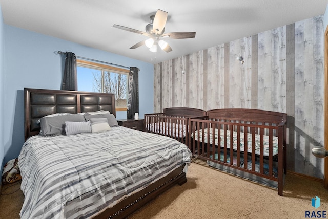 bedroom with ceiling fan and carpet