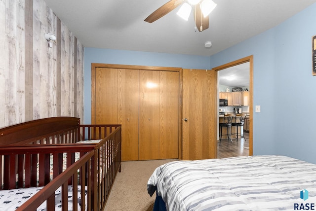 carpeted bedroom with a closet and ceiling fan