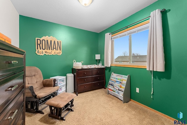 sitting room featuring light carpet