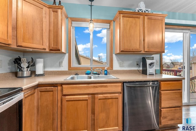 kitchen with a healthy amount of sunlight, sink, stainless steel dishwasher, and electric range