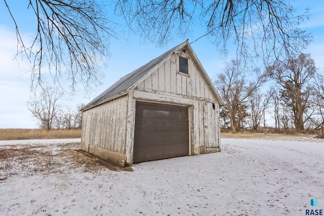 view of snow covered garage