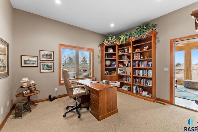 carpeted office space with plenty of natural light