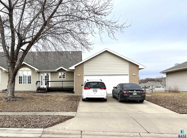 ranch-style home featuring a garage