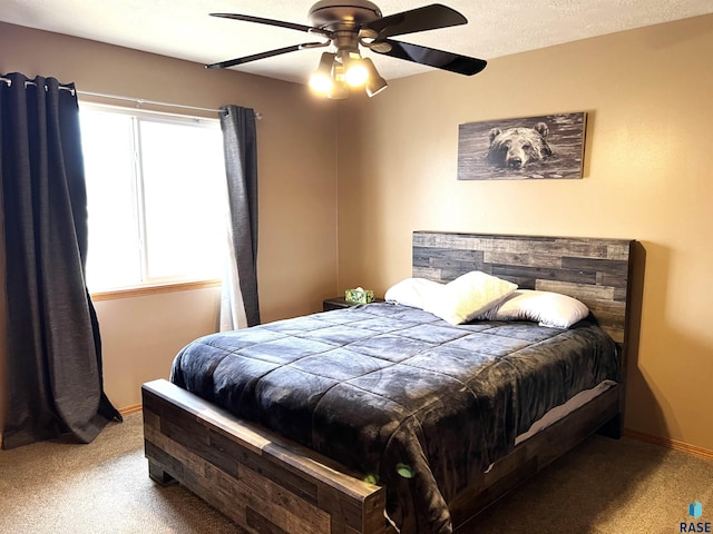 bedroom featuring carpet, a textured ceiling, and ceiling fan