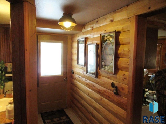 doorway with rustic walls