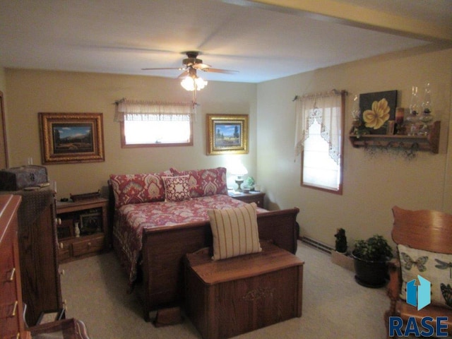 bedroom with light colored carpet and ceiling fan