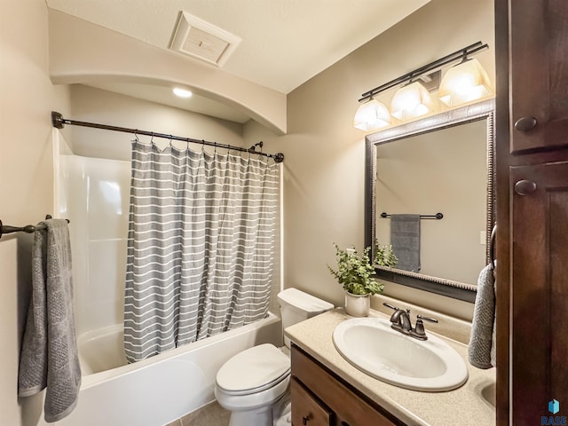 full bathroom with vanity, toilet, and shower / bath combo with shower curtain