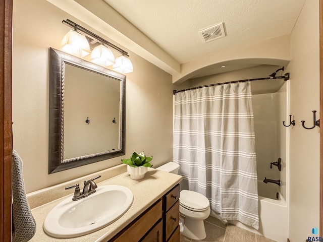 full bathroom with shower / bathtub combination with curtain, tile patterned flooring, vanity, a textured ceiling, and toilet