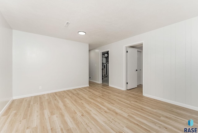 unfurnished room featuring light hardwood / wood-style floors