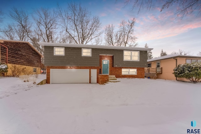 split foyer home featuring a garage