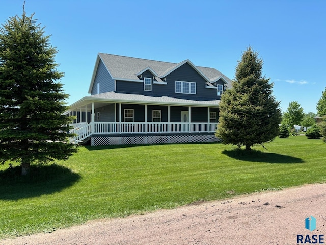 farmhouse-style home featuring a front yard and a porch