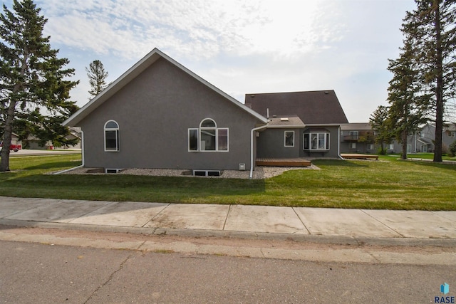 view of home's exterior with a lawn