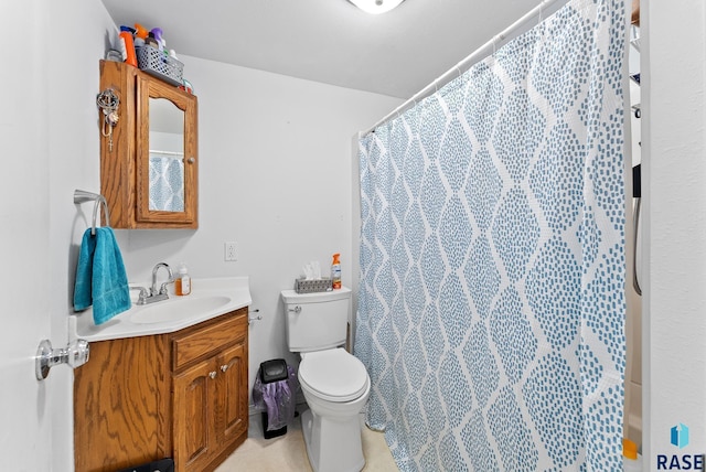 bathroom with vanity, a shower with curtain, and toilet