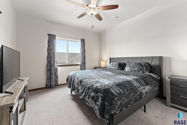 bedroom featuring light colored carpet and ceiling fan