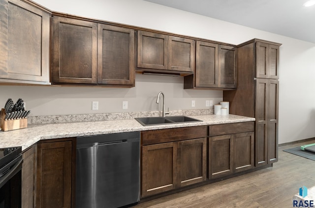 kitchen featuring dark brown cabinetry, sink, wood-type flooring, and dishwasher