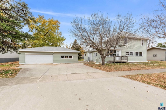 view of front of home featuring a garage and a deck