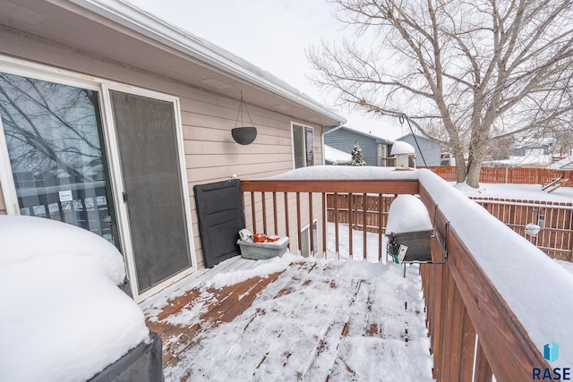 view of snow covered deck