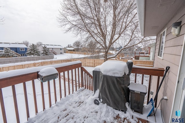 view of snow covered deck