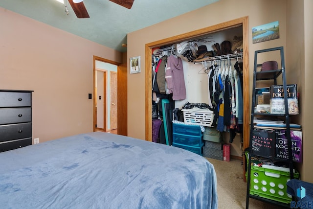 bedroom featuring carpet flooring, ceiling fan, and a closet