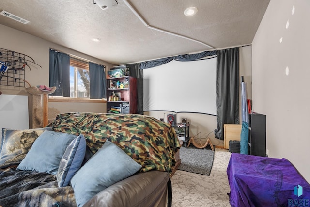 carpeted bedroom with a textured ceiling